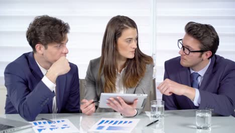 Business-people-discussing-a-project-in-an-office