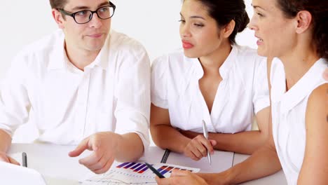 Business-people-having-a-meeting-at-desk