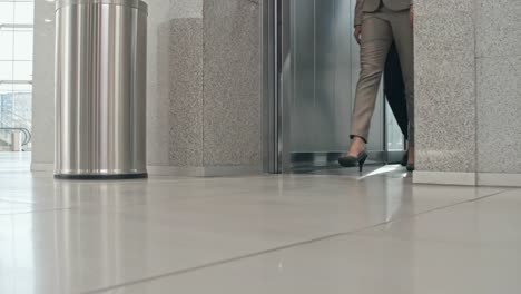 Businesspeople-exiting-elevator