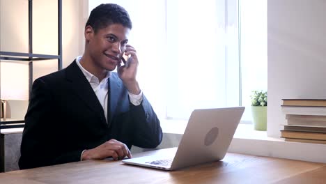 Phone-Talk,-Black-Businessman-Attending-Call-at-Work