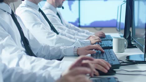 Group-People-working-in-bright-Office.-Shot-of-Typing-Hands-while-working-on-the-Computer.