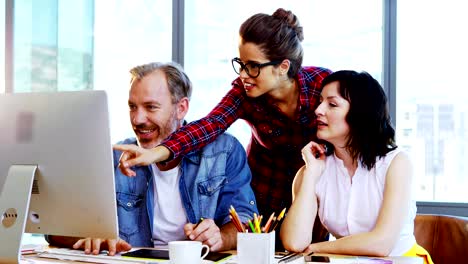 Group-of-graphic-designers-working-together-at-desk