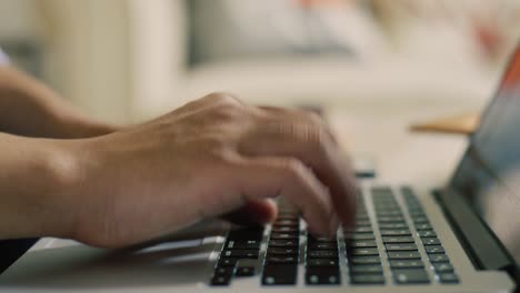 Closeup-of-Man-Typing-on-Laptop