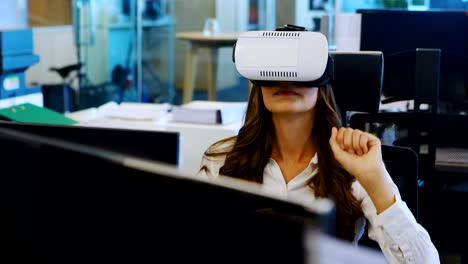 Female-executive-using-virtual-reality-headset