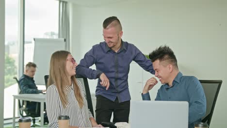 Two-People-are-Working-on-a-Laptop