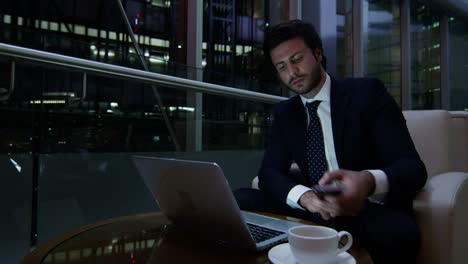Middle-Eastern-businessman-working-with-laptop-smart-phone