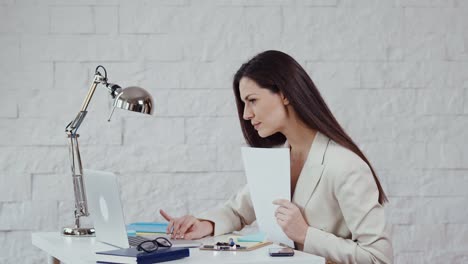 beautiful-young-businesswoman-working-with-documents