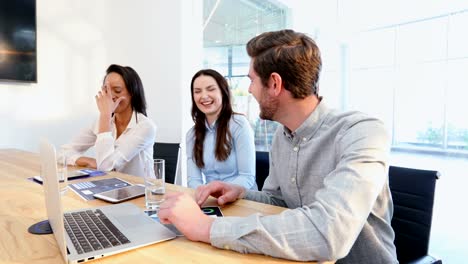 Business-colleagues-interacting-with-each-other-in-conference-room-4k