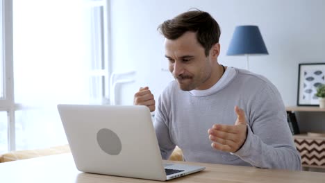 Adult-Man-Celebrating-Success,-Working-on-Laptop