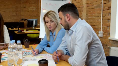 Business-team-meeting-involved-diverse-people-participating-in-creative-sustainable-ideas-steadicam-shot-across-boardroom-table-shared-work-space