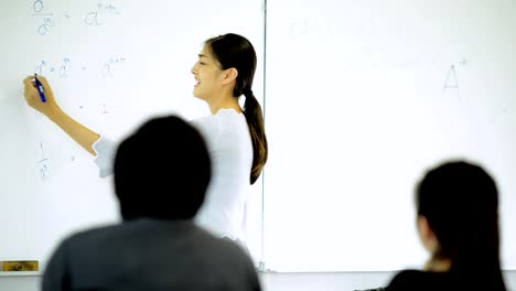 Junior-lecturer-teaching-her-students-in-a-class-room.