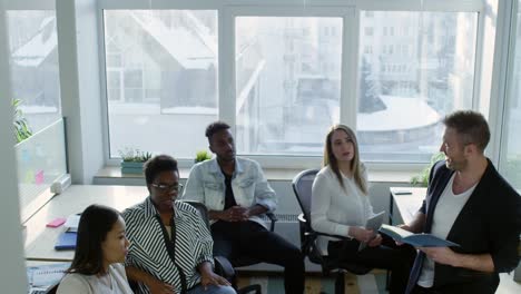 Smiling-Colleagues-Having-Informal-Meeting-with-Male-Manager