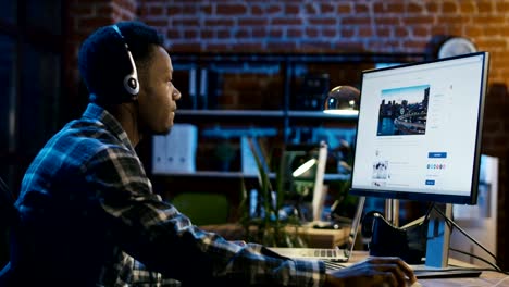 Man-in-headset-surfing-Internet-in-office