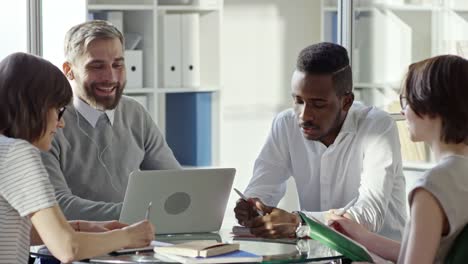 Smiling-Man-Chatting-via-Web-Call-during-Business-Meeting