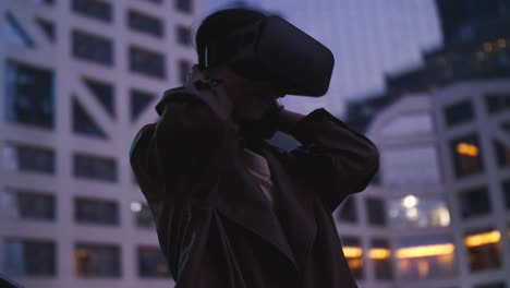 slow-motion-of-one-pretty-young-asian-woman-with-VR-,virtual-reality-headset--outdoor-in-the-city-park