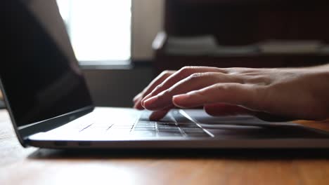 Closeup-hands-working-and-typing-on-laptop-keyboard