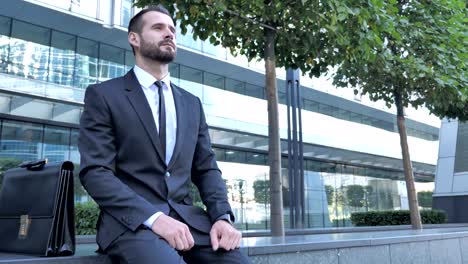 Waiting-Businessman-Sitting-Outside-Office