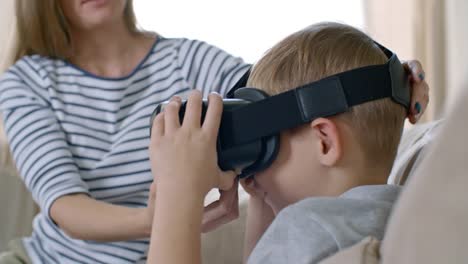 Mother-Putting-VR-Goggles-on-Son