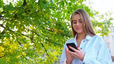 Woman-Using-Smartphone-Looking-Happy