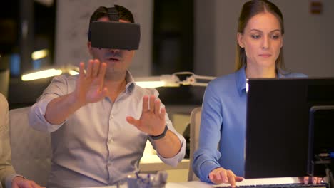 team-with-virtual-reality-headset-at-night-office