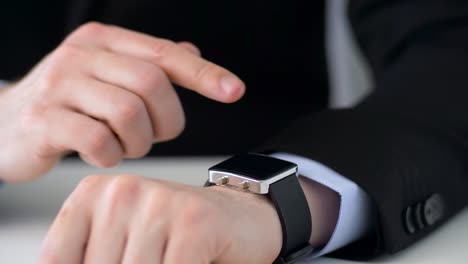 businessman-working-with-smartwatch