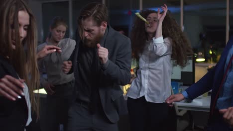 Group-of-Colleagues-Dancing-in-Office