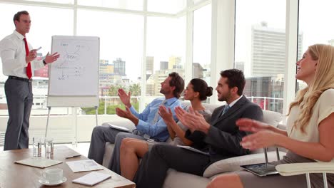 Business-team-listening-to-presentation