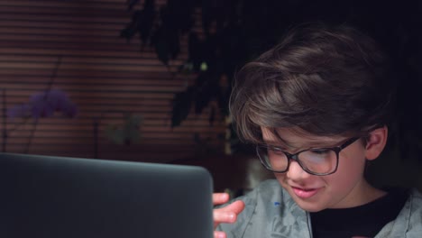 4K-Business-Shot-of-a-Child-Working-on-Computer-and-Being-Tired