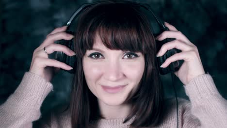 4k-Shot-of-a-Woman-with-Headphones-Listening-Music