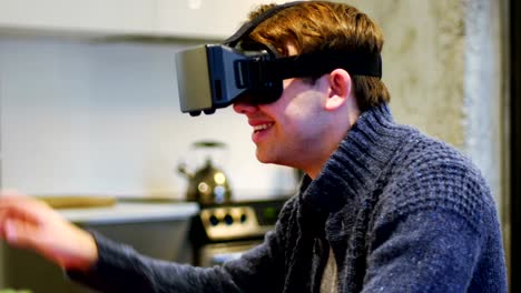 Man-using-virtual-reality-headset-at-home