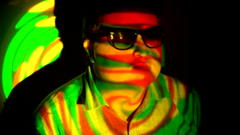 Portrait-of-a-fat-man-in-a-multicolored-light-beam.