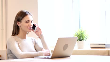 Female-Designer-Talking-on-Phone-at-Work,-New-Project