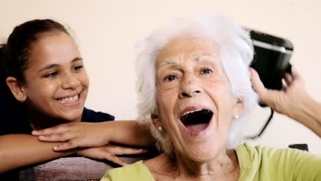 VR-Game-With-Happy-Grandma-And-Girl-Playing-Smiling-Laughing