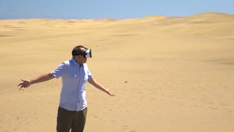 Video-of-man-exploring-virtual-reality-on-the-desert-in-4k