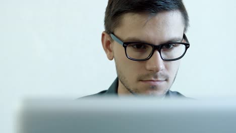 Young-man-working-on-a-computer