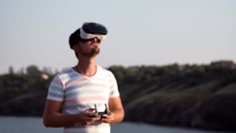 Man-in-VR-glasses-controlling-drone