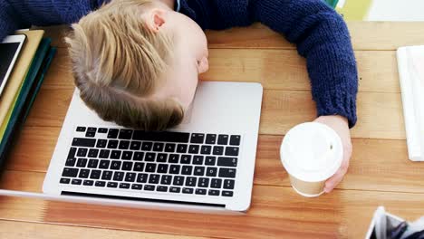 Boy-sleeping-at-office-desk-4k