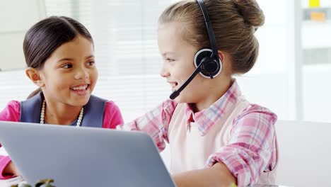 Girls-as-executives-discussing-over-the-laptop-in-office-4K-4k