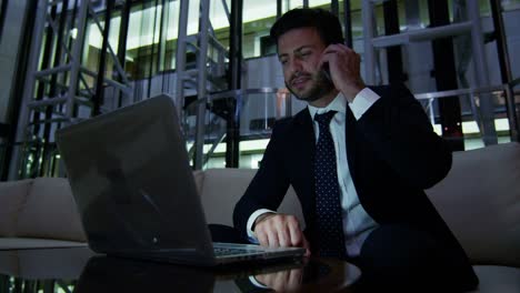 Arabic-businessman-night-office-technology-laptop-smart-phone