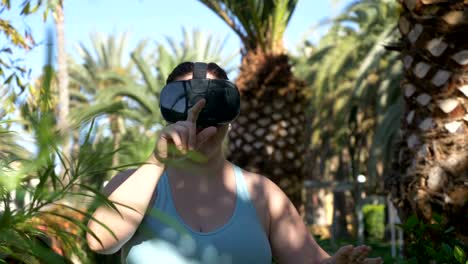 Video-of-woman-exploring-virtual-reality-in-tropical-resort-in-4k