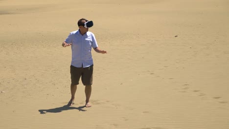 Video-of-man-exploring-virtual-reality-on-the-desert-in-4k