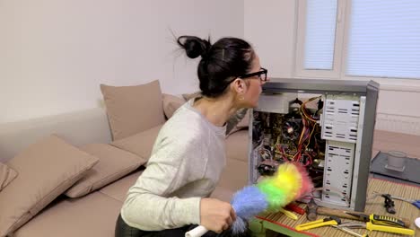 Woman-cleaning-broken-computer