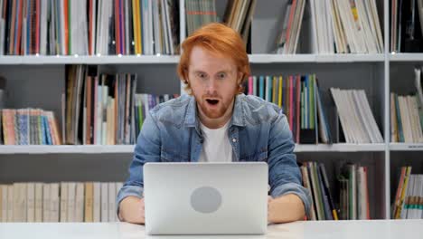 Shocked,-Stunned-Man-with-Red-Hairs-Working-on-Laptop