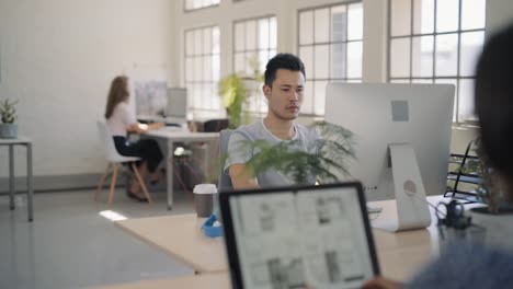 Group-of-people-in-open-plan-office-space