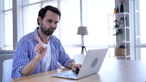 No,-Casual-Beard-Man-Rejecting-by-Waving-Finger,-While-Working-on-Laptop-,4k-,-high-quality