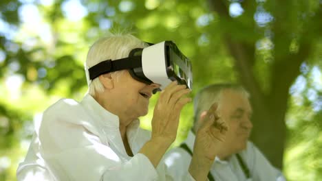 Mature-woman-using-virtual-reality-glasses