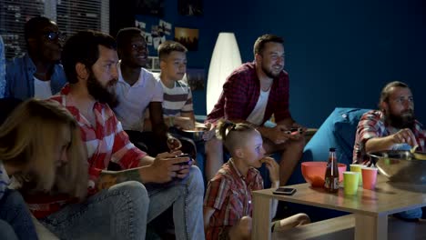 Diverse-people-entertaining-with-videogame