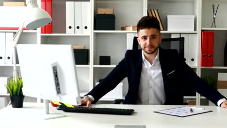 businessman-in-suit-coat-showing-thumb-up