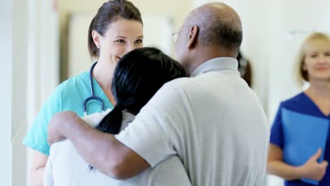 Caucasian-female-staff-consult-with-African-American-couple