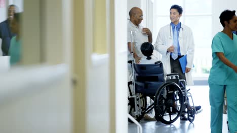 Ethnic-disabled-senior-female-in-wheelchair-in-hospital